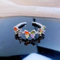 Macro shot of colorful zircon butterfly ring with vibrant gems on a reflective surface - Continuous Butterfly Row Style (JZ2997A)