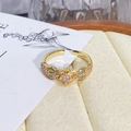 Detailed macro view of vintage gold flower ring with pink enamel and gemstone center - Adjustable Open / Pink and Green Enamel Center Diamond Style (JZ0716A)