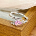 Macro shot of silver twig ring with pink pear-cut gemstone and fine zircon accents - Pink Pear Gemstone Style (JZ0869)