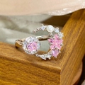 Detail of pink zircon moon and star open ring with pearl on a wooden texture background - Star Moon Combination Style (JZ3977A)