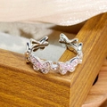 Detail of silver adjustable ring with pink zircon butterfly charms and polished finish - Continuous Butterfly Band Style (JZ4576)