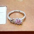 Macro shot of silver ring featuring pink cubic zirconia flower and butterfly details - Butterfly And Flower Combo Style (JZ3792)