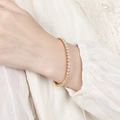 Elegant gold-plated tennis bracelet featuring a full row of white round-cut zircons - White Zirconia Style