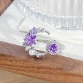 Detailed macro shot of an open ring featuring purple zircons, stars, moons, and a pearl - Star Moon Pearl Design (JZ3976)