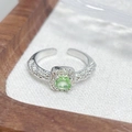 Close-up of square green gemstone ring with pavé diamonds on an adjustable band - Square Light Green Main Stone Style (JZ2214A)