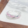 Macro shot of pink marquise-cut zircon stones on a silver-tone adjustable crisscross ring - Pink Marquise Cut Crossover Style (JZ2540A)