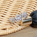 Detailed view of silver butterfly rings with pavé cubic zirconia on a woven background - Butterfly Continuous Pave Style (JZ2740)