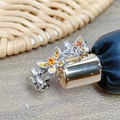 Macro detail of silver butterfly ring with vibrant orange cubic zirconia stones - Orange Yellow Butterfly Wrap Style (JZ4574)