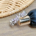 Detailed macro shot of the silver butterfly ring with sparkling pink zircon wing inlay - Pink Zircon Inlaid Ethereal Butterfly Style (JZ4576)