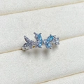 Macro detail of silver butterfly ring featuring blue marquise-cut stones and zircon pave - Adjustable Open / Blue Marquise Stone Triple Butterfly Style (JZ0272A)