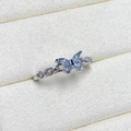 Macro shot of silver butterfly ring with light blue zircons and hollow chain band - Adjustable Open / Blue Marquise Stone Chain Butterfly Style (JZ0959A)