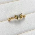 Detailed macro view of butterfly ring with olive green gems and gold chain band - Adjustable Open / Gold Olive Green Gemstone Chain Butterfly Style (JZ3242A)