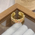 Detailed macro of vintage adjustable gold ring with floral enamel and pink gemstone - Adjustable Open / Oval Pink Gem Enamel Floral Style (JZ6007)