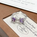 Close-up of bow ring with purple marquise stones on vintage wooden jewelry box - Adjustable Open / Purple Marquise Stone Bowknot Style (JZ3064)