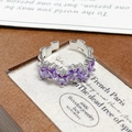 Macro shot of silver ring featuring five square purple zircons on a leather gift box - Adjustable Open / Five Square Purple Zircon Style (JZ3477)