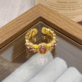Macro detail of vintage gold open ring featuring purple gemstone and enamel butterfly petals - Adjustable Open / Purple Oval Stone Butterfly Chain Style (JZ6087)