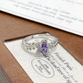 Macro detail of purple zircon flower ring with silver leaf engravings on the band - Adjustable Open / Purple Oval Floral Inlaid Style (JZ5469)