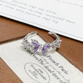 Close-up of silver butterfly ring with purple zircon crystals and twisted band detail - Adjustable Open / Triple Butterfly Purple Stone Style (JZ5519)