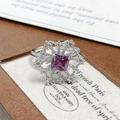 Macro view of vintage silver snowflake ring with purple square gemstone and micro-pave crystals - Adjustable Open / Square Purple Stone Snowflake Style (JZ5911)