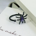 Detailed macro view of a black spider ring featuring purple zircon stones and a goth design - Open Adjustable / Spider Shape Style (JZ4452A) / Black and Purple