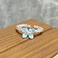 Close-up of sky blue enamel flower ring with twisted silver rope band and zircon center - Blue Single Flower Twist Rope Style (JZ1855A)