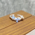Close-up of floral enamel ring with blue gradient petals and small zircon centers - Gradient Blue Three Flower Style (JZ2457A)