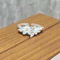 Detailed macro view of adjustable silver flower ring with blue enamel and clear zircons - Light Blue Gradient Petal Style (JZ3340A)