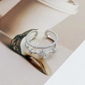 Detailed macro view of silver star shaped ring with sparkling clear zircon stones - Adjustable Open / Double Layer Star Style (JZ0267A)