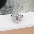 Close-up of a floral silver ring with an oval purple gemstone and pavé diamond halo - Vintage Flower Cluster Style(JZ4803)
