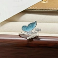 Macro shot of butterfly ring with blue enamel wings, zircon accents and tiny pearls - Light Blue Enamel Butterfly Style (JZ0861A)