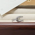 Macro shot of silver-colored open ring with baguette-cut zircons and micro-pave setting - Geometric C-Shape Pave Style (JZ1308)