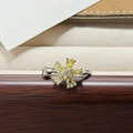 Close-up of a silver ring featuring yellow petal-shaped gems and a sparkling center zircon - Yellow Teardrop Flower Style (JZ3084A)