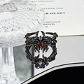 Macro shot of gothic spider ring with red drop-shaped stone and purple zircon detail - Spider Waterdrop Red Stone Style (JZ2796)
