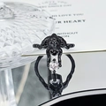Detailed macro view of black punk spider ring holding a brilliant round white zircon stone - Diving Creature White Zircon Style (JZ3269)