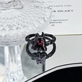 Detail view of a black punk ghost ring with red accents and a reflective surface - Cartoon Little Ghost Style (JZ3417)