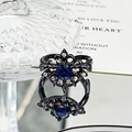 Detail of gothic black metal ring with a blue heart gemstone and silver diamonds - Dark Blue Heart Vintage Style (JZ4130)