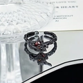 Detail of gothic ring with red faceted gemstone and dark wood texture finish - Red Stone Withered Wood Style (JZ5289)