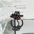 Macro detail of punk black cat ring with red dagger on reflective mirror surface - Black Cat Dagger Style (JZ5544)