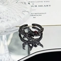 Detailed view of Gothic black raven ring with red gemstone and feather textures - Double Bird Red Stone Style (JZ5566)