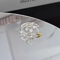 Detail view showing three blooming silver flower rings with gold centers and mirror reflection - Three White Flowers Pastoral Style (JZ0196)