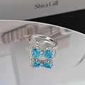 Detailed view of silver bow ring featuring blue heart-shaped stones and shimmering cubic zirconia - Blue Heart Bowknot Style (JZ0273A)