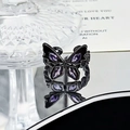Macro detail of gothic butterfly ring with black plating and four purple marquise stones - Purple Butterfly Wing Style (JZ0313)