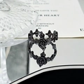 Detailed view of black gothic rose ring with thorn band on reflective surface - Black Rose Thorn Style (JZ0524)