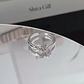 Macro shot of silver bow ring with pink marquise-cut stones and sparkling zircon details - Pink Clover Bowknot Style (JZ3204A)