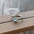 Close-up of aquamarine square stone and diamond-set fishtail on an adjustable silver ring - Mermaid Tail Square Blue Style (JZ5582)