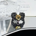 Detailed close-up of gothic heart ring with yellow gemstone and black floral carving - Yellow Heart Hollow Style (JZ2253)