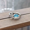 Close-up of sea blue pear-cut gemstone and sparkling fish tail detail on silver ring - Mermaid Tail Water Drop Blue Style (JZ5589)