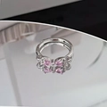 Macro shot of silver bow ring featuring pink pear-cut gemstones and sparkling cubic zirconia - Pink Pear Zircon Bowknot Style (JZ5696)