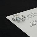 Macro shot of adjustable silver ring with moonstone and cubic zirconia clusters - Blue Stone Flower Cluster Style (JZ3030A)