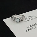 Detail of adjustable silver ring with blue moonstone and marquise zircon accents - Hammered Oval Blue Stone Style (JZ4315A)